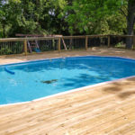 treated pine deck surrounding above ground pool 18